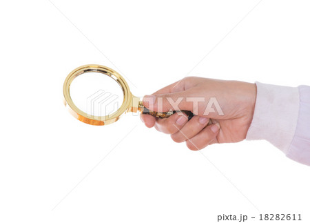 hand holding a Brass Magnifying Glas 18282611