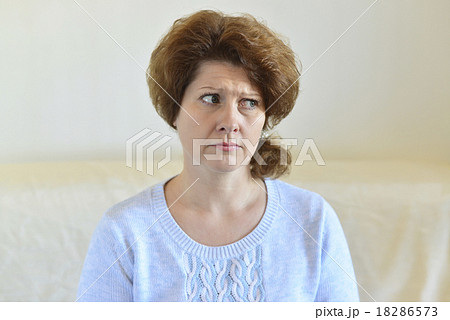 Sad woman looking away at home in  living room 18286573