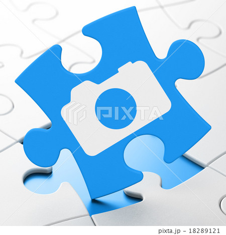 Tourism concept: Photo Camera on puzzle background Tourism concept: Photo Camera on puzzle background 18289121