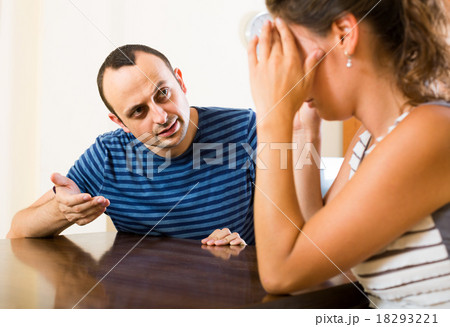 family couple shouting while arguing indoors 18293221