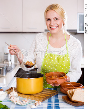 blonde in apron with meat 18293454