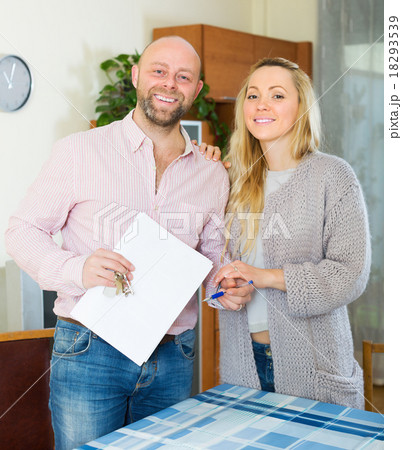 Couple with keys and documents Couple with keys and documents 18293539
