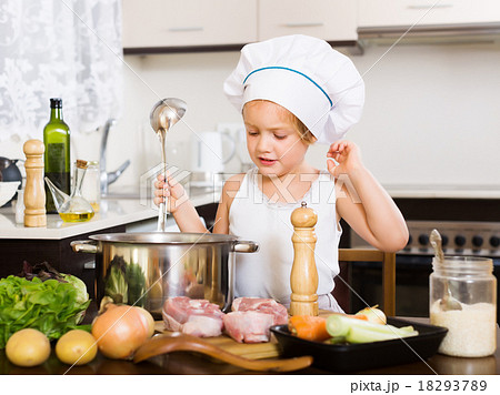 girl cooking soup in pan 18293789
