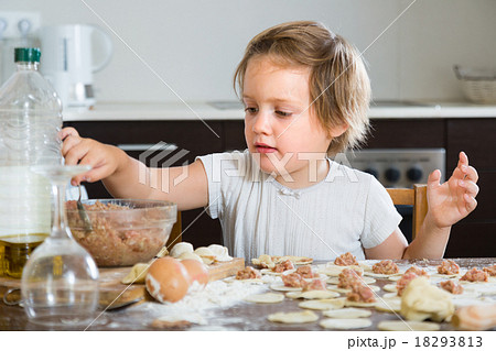 Child cooking meat dumplings 18293813
