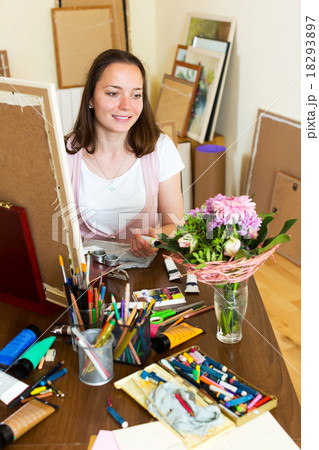 young artist paints a picture 18293897