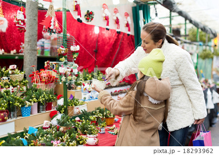 Mother and daughter choose mistletoe 18293962