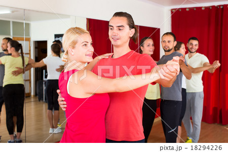 Expressive couple learning tango Expressive couple learning tango 18294226
