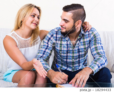 Couple making list of purchases. Couple making list of purchases. 18294433