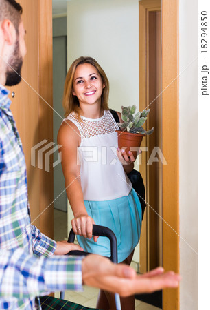 girl and her boyfriend with luggage moving together 18294850