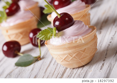 tartlets with soft cream and cherries closeup tartlets with soft cream and cherries closeup 18297392