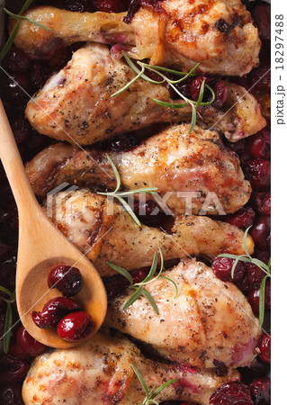 Baked chicken leg with cherry macro. top view Baked chicken leg with cherry macro. top view 18297488