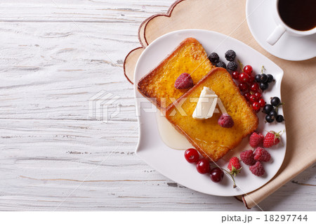 French toast with honey and berries top view 18297744