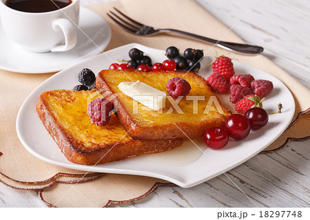Two sweet toast with honey and berries close-up 18297748