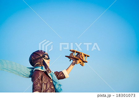 Happy child playing with toy airplane 18301073