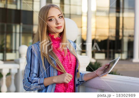 Young girl checking her tablet computer Young girl checking her tablet computer 18302989