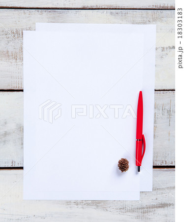 The blank sheet of paper on the wooden table with 18303183
