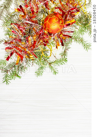 one orange Xmas ball and twig on blank paper one orange Xmas ball and twig on blank paper 18308450