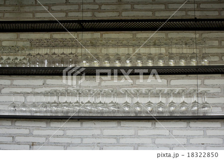 Empty glasses for wine above a bar rack Empty glasses for wine above a bar rack 18322850