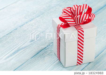 Christmas gift box on wooden table Christmas gift box on wooden table 18324960