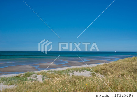 Beach with low tide water Beach with low tide water 18325695