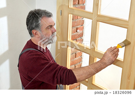 Home renovation, worker painting wooden door Home renovation, worker painting wooden door 18326096