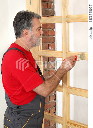 Home renovation, worker painting wooden door Home renovation, worker painting wooden door 18326097