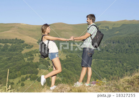 Happy hikers couple in the mountains 18327255