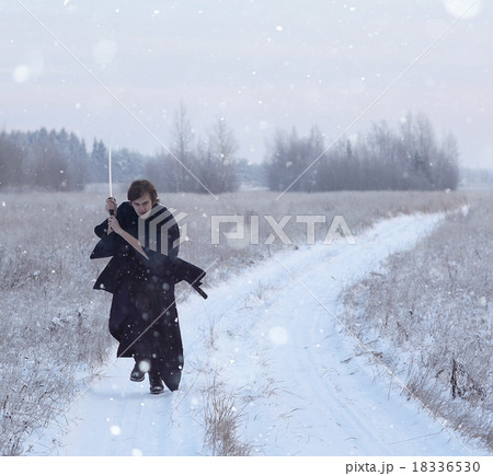 running samurai wearing a kimono in a winter field dressed in black, frost running samurai wearing a kimono in a winter field dressed in black, frost 18336530