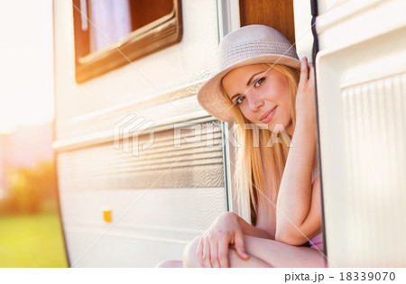 Beautiful woman in a camper van Beautiful woman in a camper van 18339070