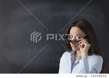 Business woman in front of blackboard 18339659