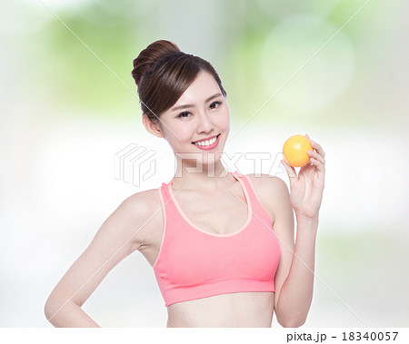 Woman show orange benefit health 18340057
