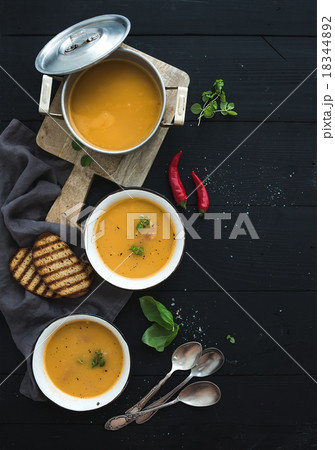 Red lentil soup with spices, herbs, bread in a Red lentil soup with spices, herbs, bread in a 18344892