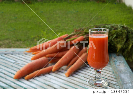 A glass of fresh carrot juice 18347554