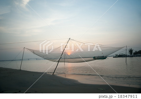 Calm scene of fishing net against purple sunset. Calm scene of fishing net against purple sunset. 18347911