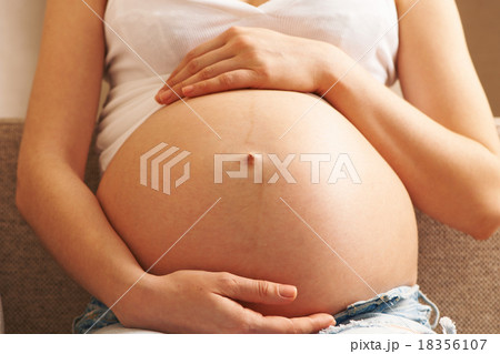 Pregnant woman at home Pregnant woman at home 18356107