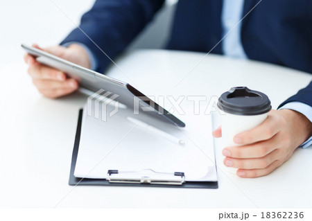 Office worker with tablet and papercup of coffee. Office worker with tablet and papercup of coffee. 18362236
