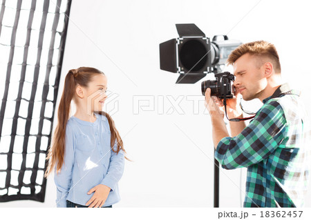 Little girl enjoys her time during photoshooting. Little girl enjoys her time during photoshooting. 18362457