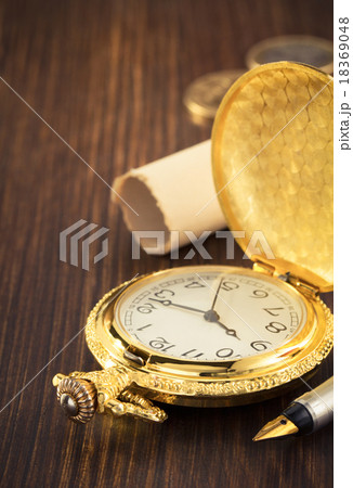 old pocket watch on wood 18369048