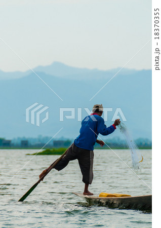 Fisherman at Inle Lake working on one foot 18370355