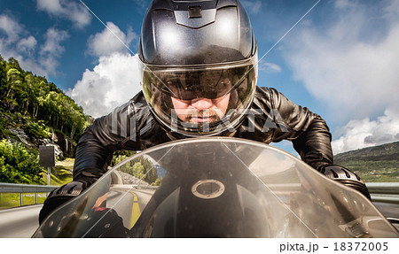 Biker racing on the road 18372005