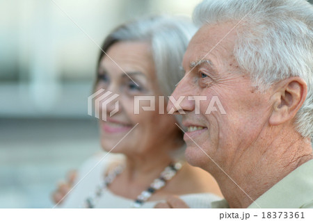 Happy nice mature couple walking Happy nice mature couple walking 18373361