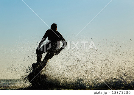 Silhouette of a fly board rider Silhouette of a fly board rider 18375286