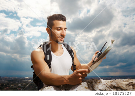 Young man tourist with a backpack 18375527