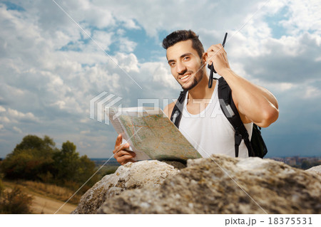 Young man tourist with a backpack 18375531