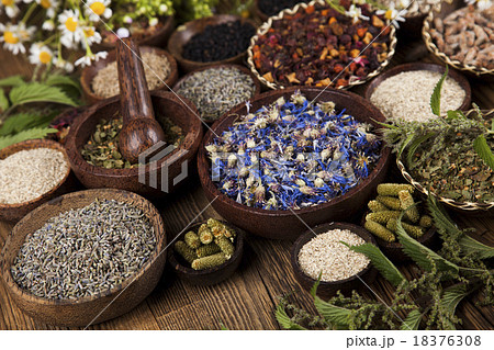 Natural medicine, wooden table background Natural medicine, wooden table background 18376308