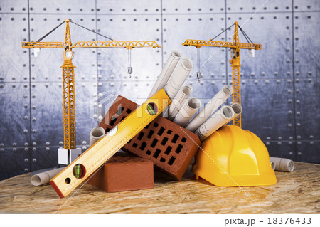 Construction plan with a crane and yellow helmet 18376433