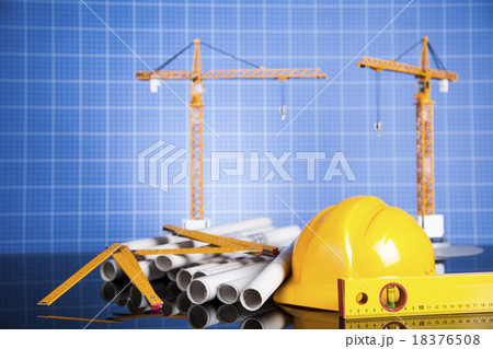 Construction plan with a crane and yellow helmet Construction plan with a crane and yellow helmet 18376508