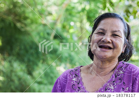 Old thai woman in garden Old thai woman in garden 18378117