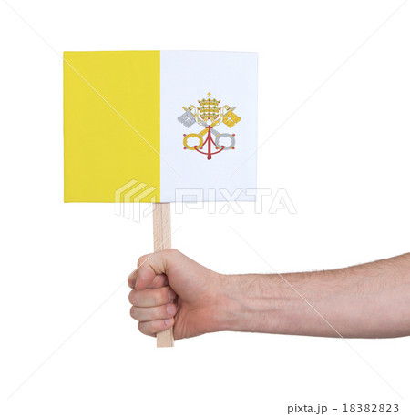 Hand holding small card - Flag of Vatican City 18382823