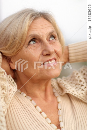senior woman in summer park 18383696